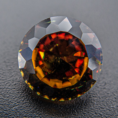 Andradite Garnet from Namibia. 3.16 Carat. Andradite with spectacular dispersion ("fire"). By all means, look at the video!