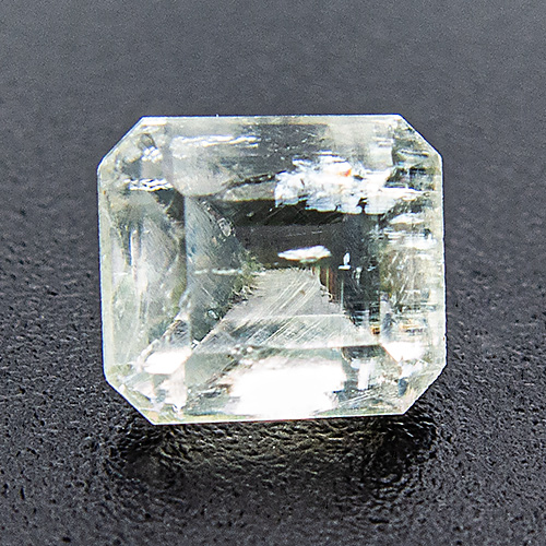 Thaumasite from South Africa. 0.72 Carat. Emerald Cut, very distinct inclusions