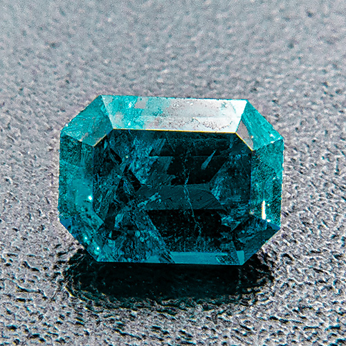 Dioptase from Argentina. 0.27 Carat. Emerald Cut, very distinct inclusions