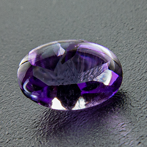 Amethyst from Brazil. 1 Piece. Bufftop Oval, very small inclusions