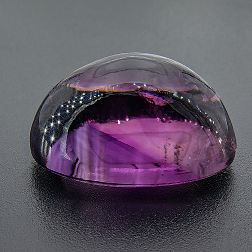 Amethyst from Zambia. 26.7 Carat. Cabochon Oval, distinct inclusions