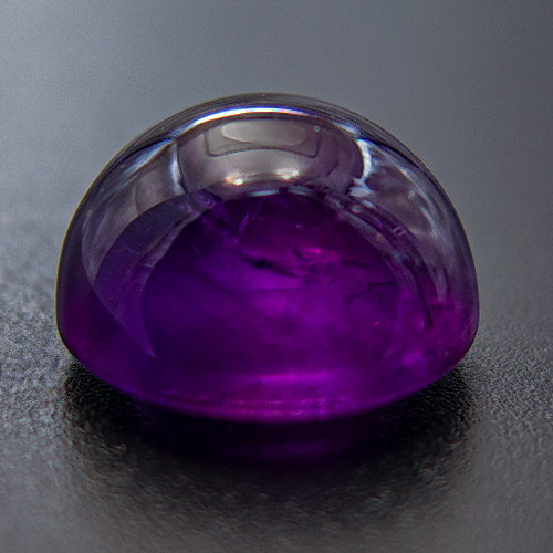 Amethyst from Zambia. 9.03 Carat. Cabochon Round, very distinct inclusions