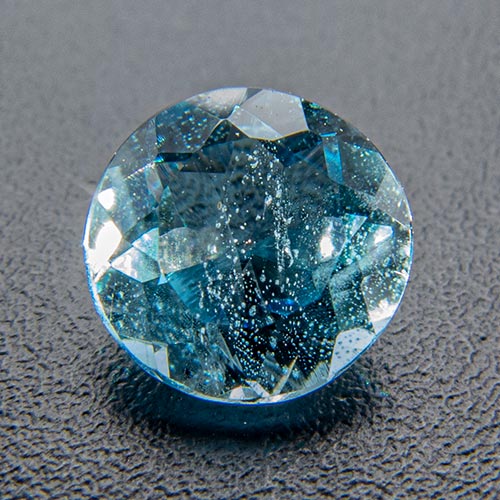 Aquamarine from Brazil. 0.59 Carat. Exceptional colour. Slight asymmetry can be masked in bezel setting.