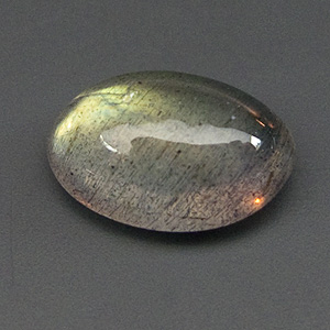Spectrolite from Madagascar. 0.99 Carat. Cabochon Oval, very distinct inclusions