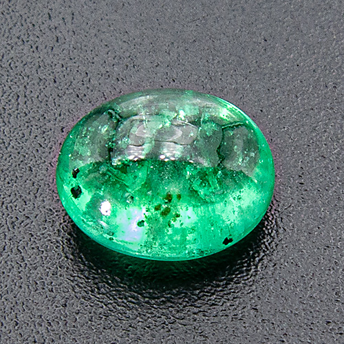 Emerald from Brazil. 1.34 Carat. Cabochon Oval, very distinct inclusions