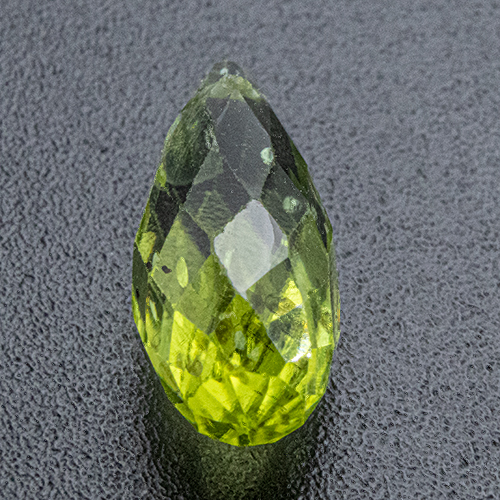 Peridot from Myanmar. 2 Carat. Drilled horizontally at the tip