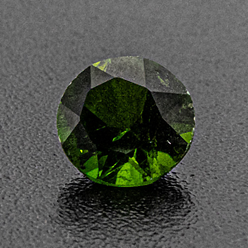 Chrome diopside from Russia. 0.35 Carat. Round, distinct inclusions