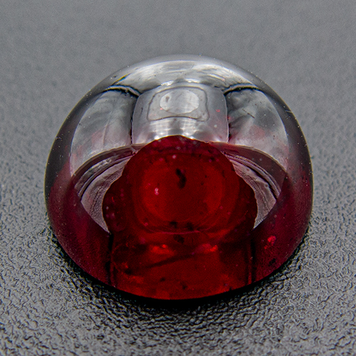 Rhodolite Garnet from India. 6.47 Carat. Cabochon Round, small inclusions