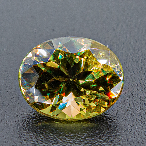Demantoid Garnet from Namibia. 0.77 Carat. Oval, small inclusions