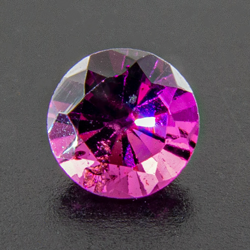 Rhodolite Garnet from India. 1 Piece. B quality, good colour, abominable cut (photo shows one of the best)