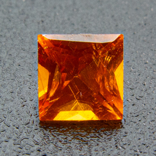 Mandarin Garnet from Namibia. 0.28 Carat. Square, distinct inclusions