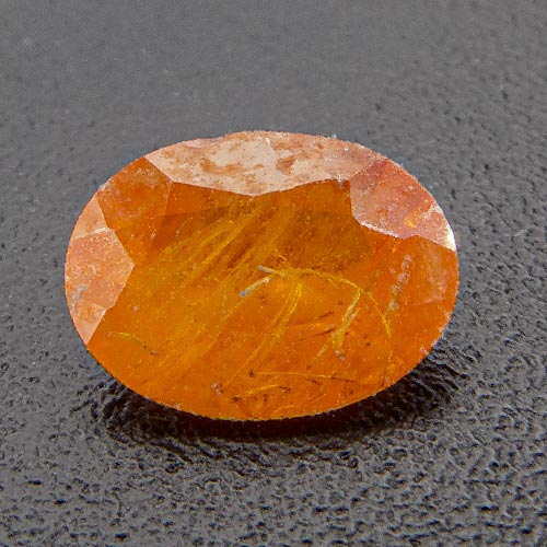 Mandarin Garnet from Namibia. 0.46 Carat. Oval, very, very distinct inclusions