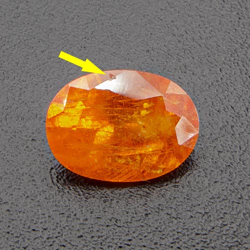 Mandarin Garnet from Namibia. 0.7 Carat. Small chip on upper side