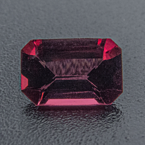 Rhodolite Garnet from India. 0.57 Carat. Emerald Cut, very small inclusions