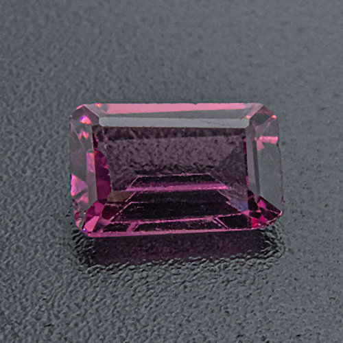 Rhodolite Garnet from India. 0.58 Carat. Emerald Cut, very small inclusions