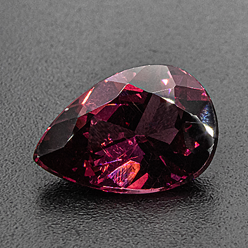 Rhodolite garnet from Tanzania. 2.39 Carat. With needle-shaped rutile inclusions