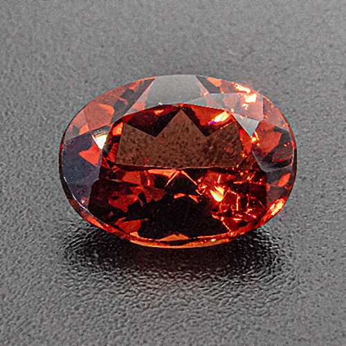 Spessartine Garnet from Brazil. 1 Piece. Photo shows sample stone. Actual colour might be slightly lighter or darker.