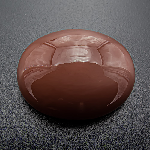 Brown Moonstone from India. 53.45 Carat. Beautiful sheen ("schiller"), produces light cat´s eye in spotlight or sunlight
