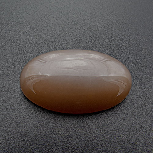 Brown Moonstone from India. 21 Carat. Beautiful schiller (adularescence). Elegantly slender shape. One of our best