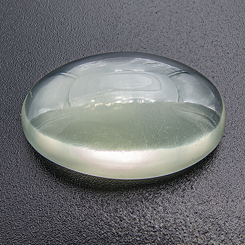 Green Moonstone from India. 23.96 Carat. Good cat´s eye in spot light (not visible on photo due to the diffuse lighting)