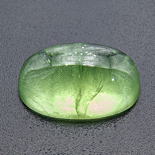 Peridot from Pakistan. 12.17 Carat. Cabochon Oval, very distinct inclusions