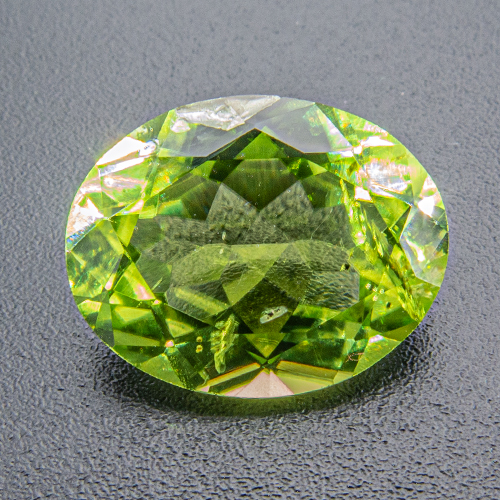 Peridot. 3.99 Carat. Due to a natural crack at the girdle we advise to set this gem with prongs
