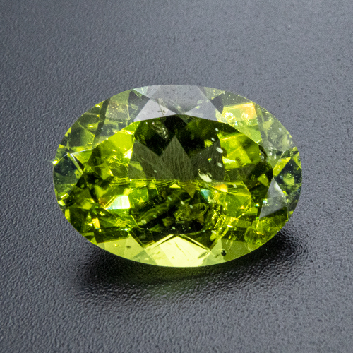 Peridot from Myanmar. 6.16 Carat. Oval, small inclusions
