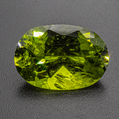 Peridot from Myanmar. 7.23 Carat. Oval, small inclusions