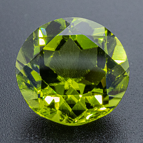 Peridot from China. 6.53 Carat. Round, very small inclusions