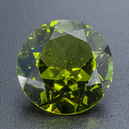 Peridot from China. 6.56 Carat. Round, small inclusions