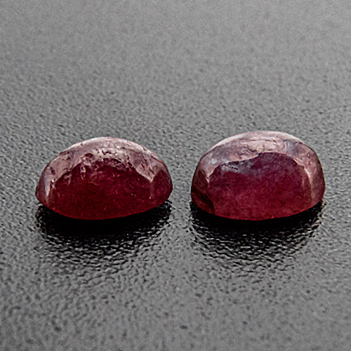 Ruby from India. 0.61 Carat. With several natural cavities on top
