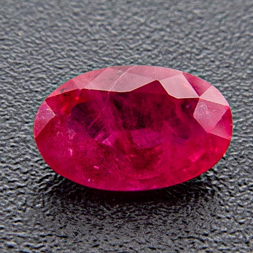 Ruby from Myanmar. 1 Piece. Oval, very, very distinct inclusions