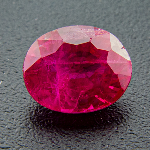 Ruby from Myanmar. 0.52 Carat. From old stock. Two minute chips, quite prominent on the enlarged photo, are hardly visible to the naked eye. The chip in 2o´clock position can be hidden under a setting. Very good colour!