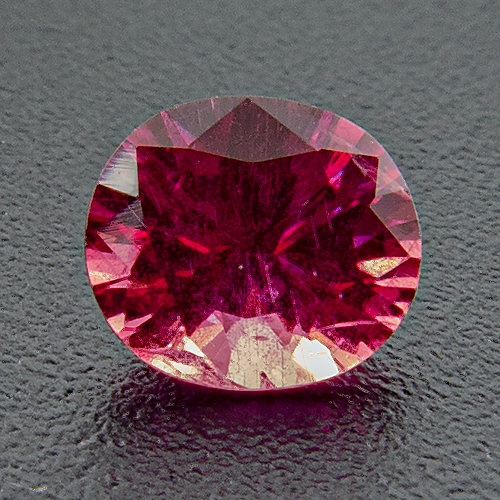 Ruby. 0.4 Carat. Oval, distinct inclusions