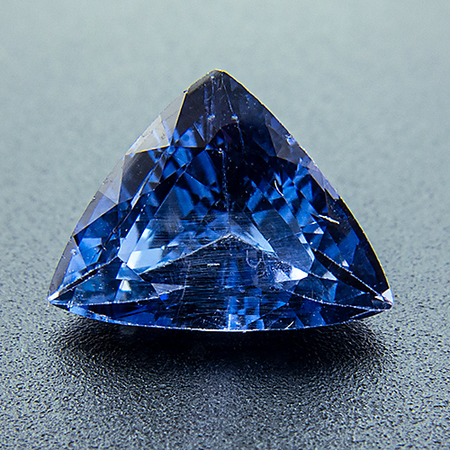 Sapphire from Sri Lanka. 1.24 Carat. Inluded rutile needles, only visible through the 10x loupe, give evidence that this gem was not heat-treated.
Very, very slightly purplish blue.