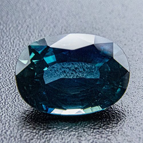 Teal sapphire from Madagascar. 1.37 Carat. Oval, distinct inclusions