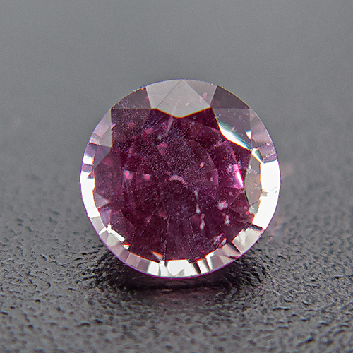 Purple Sapphire from Tanzania. 0.44 Carat. Round, distinct inclusions