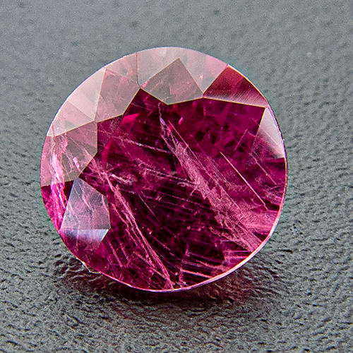 Pink sapphire from Vietnam. 0.59 Carat. Round, very distinct inclusions