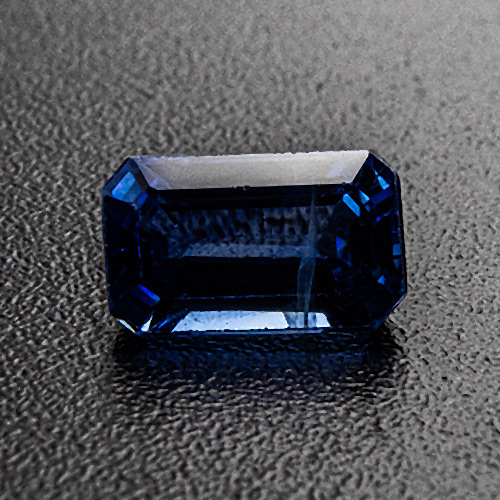 Sapphire from Thailand. 0.56 Carat. Emerald Cut, distinct inclusions