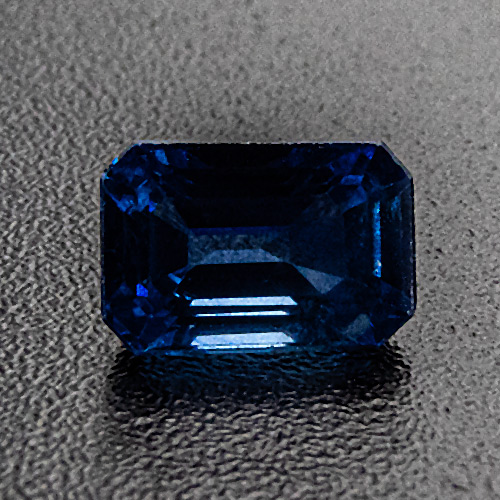 Sapphire from Thailand. 0.6 Carat. Emerald Cut, distinct inclusions
