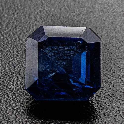 Sapphire from Thailand. 0.62 Carat. Emerald Cut, distinct inclusions