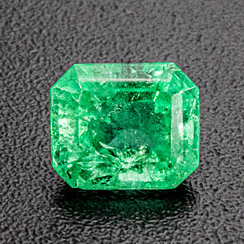 Emerald from Brazil. 0.32 Carat. Emerald Cut, very distinct inclusions