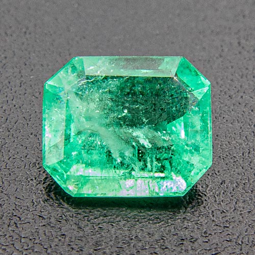 Emerald from Brazil. 0.55 Carat. Emerald Cut, very, very distinct inclusions