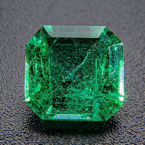 Emerald from Zambia. 0.8 Carat. Emerald Cut, very distinct inclusions