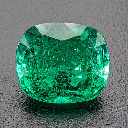 Emerald from Zambia. 0.62 Carat. One of our best. In reality inclsuions are not nearly as prominent as on the enlarged photo. Fine colour, vibrant.