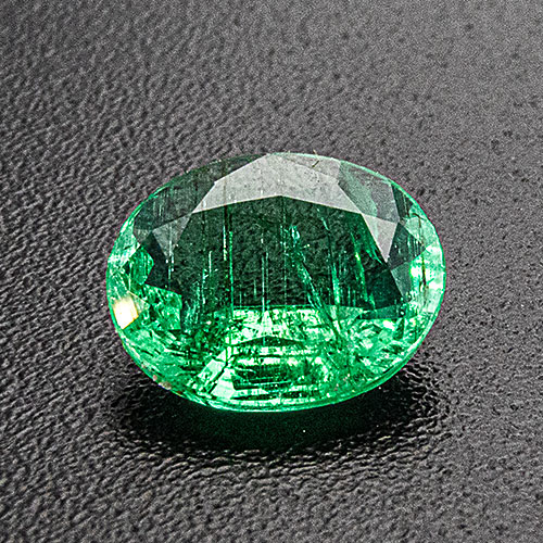 Emerald from Zambia. 0.48 Carat. Very shallow pavilion. Looks much heavier and more expensive but has a rather large "window"