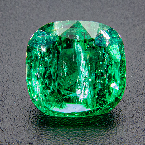 Emerald from Zambia. 1.26 Carat. Cushion, very distinct inclusions