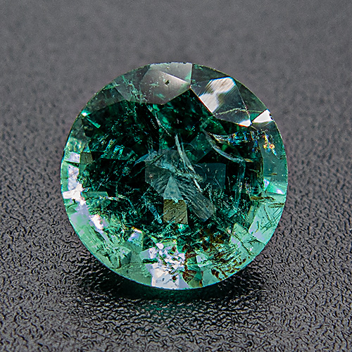 Emerald from Zambia. 0.96 Carat. Round, distinct inclusions