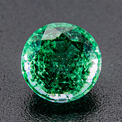 Emerald from Zambia. 0.62 Carat. Round, distinct inclusions