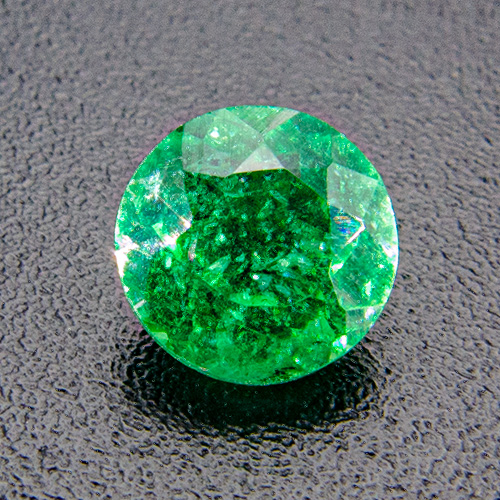 Emerald from Brazil. 0.54 Carat. Round, distinct inclusions